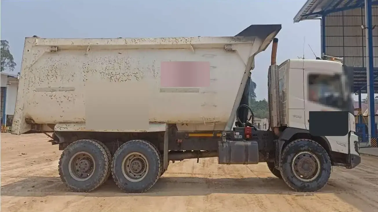 A dump truck on the yard road, ready to be collected